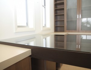 glass desk and office shelves