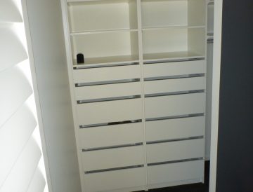 Walk-in Wardrobe white shelving drawers